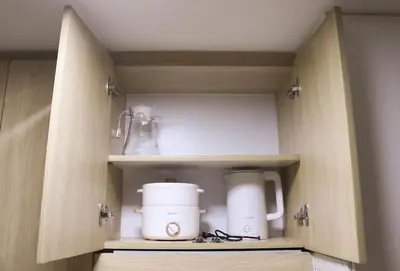 a cupboard with a coffee maker and a blender at Cozy & Affordable Staycation Melrose Haven in Manila