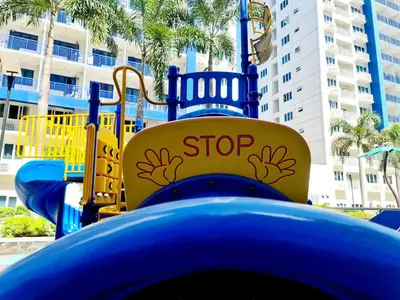 a blue water slide with a stop sign on it at Cozy MOA View Stay - Walk to Mall of Asia in Manila