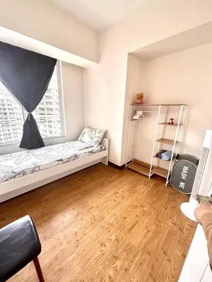 a small room with a bed and a window at Spacious 3BR 2 balcony Resort vibes near BGC in Manila