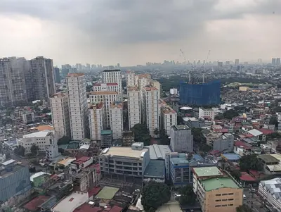 an aerial view of a city with tall buildings at pierrecondotel in Manila