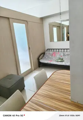 a room with a bed and a large window at Moa view sea Residences condotel in Manila