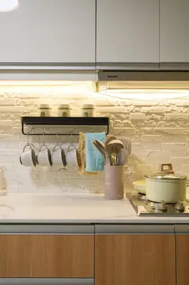a kitchen with a counter with utensils on it at Modern & Stylish Condo at One Uptown Residence in Manila