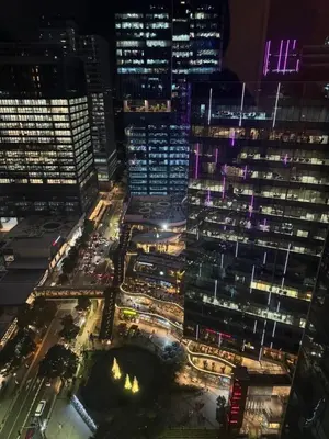 an aerial view of a city at night at Modern & Stylish Condo at One Uptown Residence in Manila