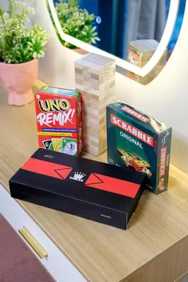 a table with two boxes of chips and a stack of cards at Modern & Stylish Condo at One Uptown Residence in Manila