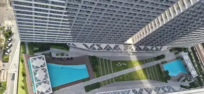 an overhead view of a large building with a pool at JCs Staycation Fame Residences in Manila