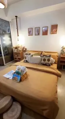 a bedroom with a large bed in a room at Azure SYM Staycation in Manila