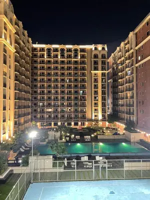 a view of a large building at night at D'Hauz 3 - Pet Friendly unit in Manila