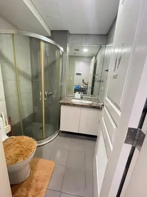 a bathroom with a shower and a sink at D'Hauz 3 - Pet Friendly unit in Manila