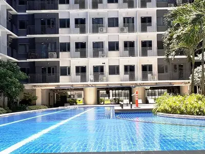 a swimming pool in front of a building at Casa Laelia in Manila