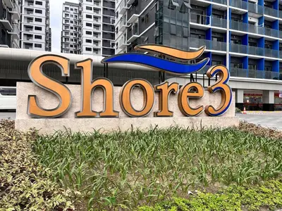 a sign for a store in front of a building at Casa Laelia in Manila