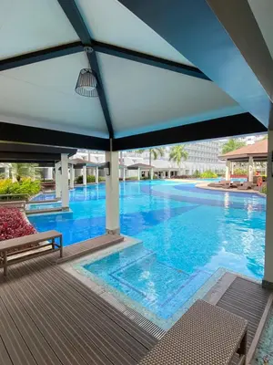 a large blue swimming pool with a blue ceiling at Budget Condo in Mall Of Asia in Manila