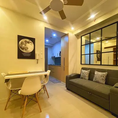 a living room with a couch and a table at Shore 2 Residences Entire Condo in Pasay City Near SM Mall of Asia in Manila
