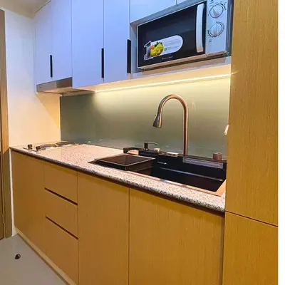 a kitchen with a sink and a microwave at Shore 2 Residences Entire Condo in Pasay City Near SM Mall of Asia in Manila