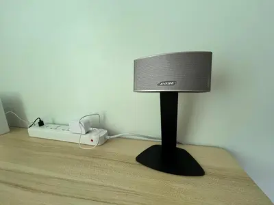 a computer monitor on a stand in a room at Ports Den in Manila