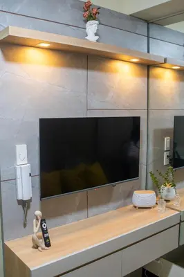 a large flat screen tv on a wall at Relaxing 1BR Balcony with Pool View Plus Free Parking in Manila