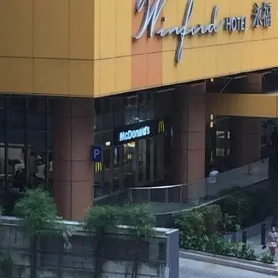 a large building with a sign on the side of it at Ports crib in Manila