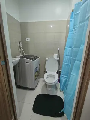 a small bathroom with a toilet and a sink at SHORe 2 TOWER 3 UNIT 746 in Manila