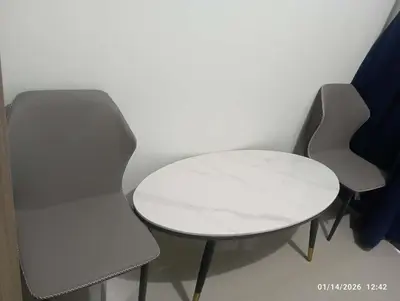 a table and two chairs and a white table and chairs at SHORe 2 TOWER 3 UNIT 746 in Manila