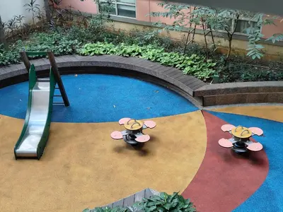 an overhead view of a pool with a mickey mouse playground at Vienna Condotel at 101 Newport Blvd in Manila