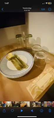 a plate of food sitting on a wooden table at Azure Haven in Manila
