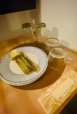 a plate of pickles on a wooden table at Azure Haven in Manila