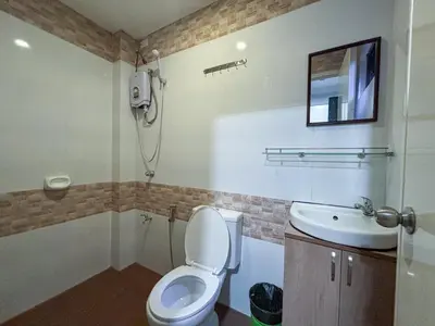 a bathroom with a toilet and a sink at The Budget Inn in Manila