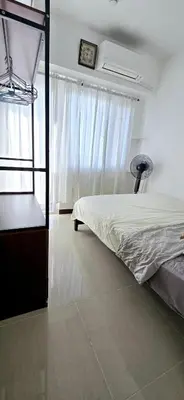 a bedroom with a bunk bed and a window at LA Nook in Manila