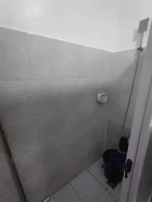a shower stall in a bathroom with a toilet at Affordable 2-Storys Whole house in Imus in Imus