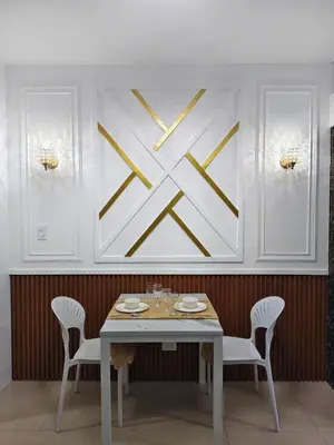 a dining room with a white table and chairs at La Casa Victoria-Near Moa and NAIA in Manila