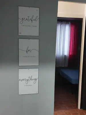 a wall with four signs on a wall at Affordable Townhouse Imus cavite greenpark villas 2 in Imus