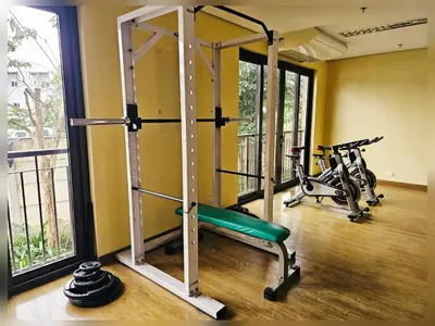 a gym with two treadmills and two bikes at Paseo Verde Condo Unit in Las Pinas - Sleeps 2 Adults & 2 Children in Manila