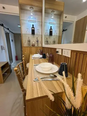 a table with plates and utensils on top of it at Casa Navarro - Estrella in Manila