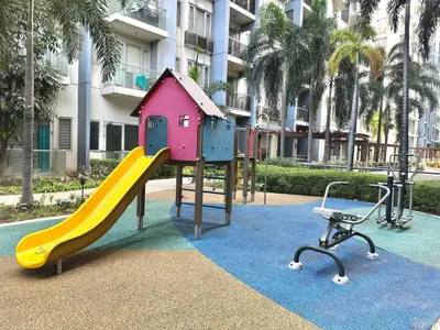 a playground with a slide and a chair at One Palm Tree Villas at Newport, Near NAIA T3 in Manila