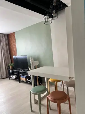 a living room with a table and four chairs at Jopays 2BR, Brand New Unit in Cainta