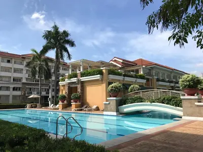 a swimming pool in front of a building at Cozy 2BR at an Italian inspired condo near Ortigas in Manila