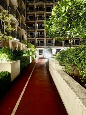 a red carpet path in a large building at Condo near MOA Monarch in Manila