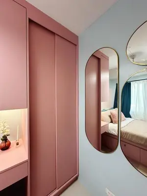 a bedroom with a mirror and a bed at The Ritz Place at Shore 3 Residences in Manila
