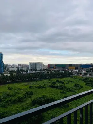 a view of a green field with buildings in the background at Shore 2 Residences in Manila