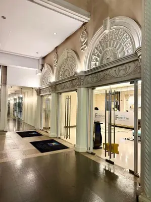 a large building with glass doors in a mall at Venice Luxe Cozy 1 BedRoom, Pool, Netflix, Kitchen, Canal Mall Access in Manila