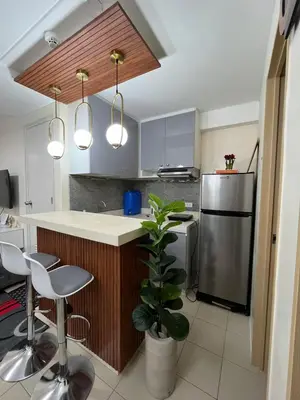 a kitchen with a stainless steel refrigerator at 2BR DECA HOME Pasig City in Manila