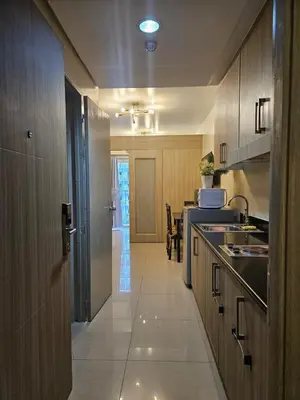 a kitchen with a sink and a counter top at Amenity Pool View 1 BR balcony MOA SMX Ikea Shore002 in Manila