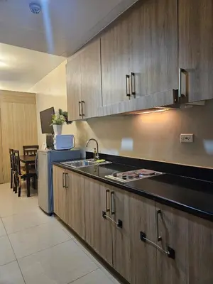a kitchen with a sink and a counter top at Amenity Pool View 1 BR balcony MOA SMX Ikea Shore002 in Manila