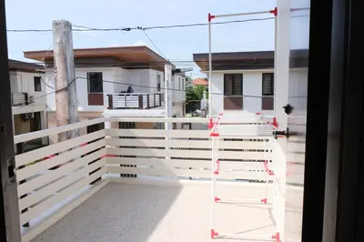 a ladder on the front porch of a house at Idesia Dasmarinas NEW 3BR home with wifi & parking in Dasmariñas
