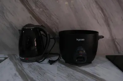 a black coffee pot sitting on top of a counter at Idesia Dasmarinas NEW 3BR home with wifi & parking in Dasmariñas