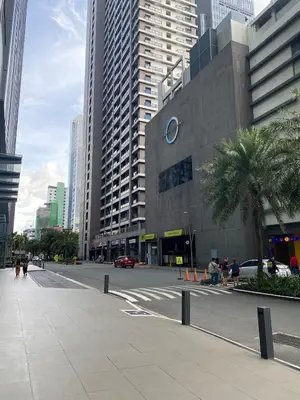 a street in a city with tall buildings at AZ Sweet home 2BR A Venue Residences Poblacion Makati in Manila