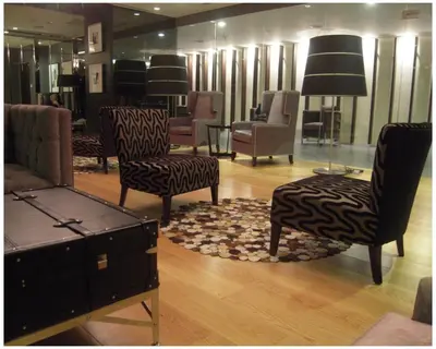 a store with chairs and tables in a room at STAYLUXIA BOUTIQUE HOTEL GRAMERCY Balcony FREE Pool, Gym, Netflix in Manila