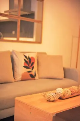 a living room with a couch and a coffee table at Cozy Tahanan Azure Studio close to NAIA in Manila