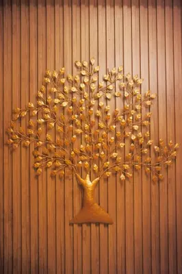 a wall with a tree made out of gold at Cozy Tahanan Azure Studio close to NAIA in Manila
