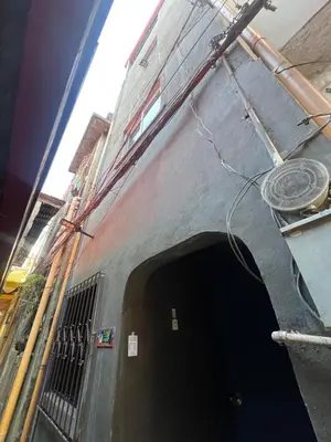 a tunnel in the side of a train at Liza homestay in Manila