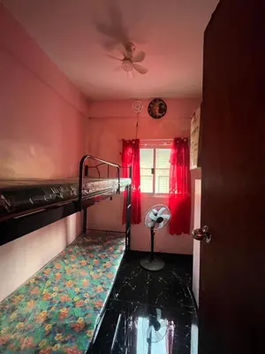 a bedroom with a bunk bed and a window at Liza homestay in Manila